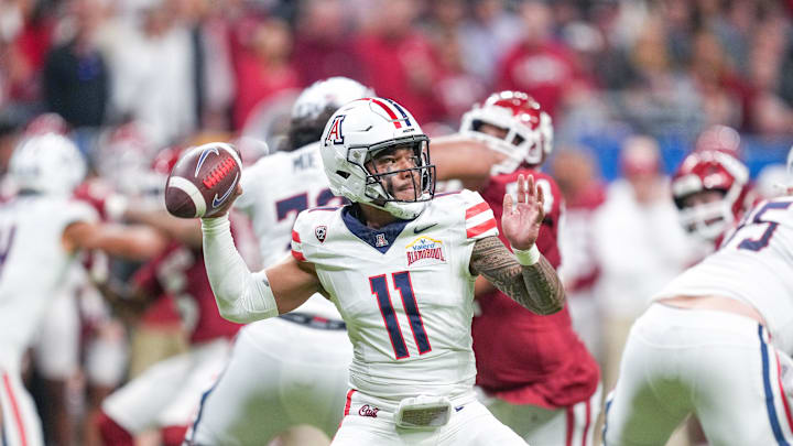 Dec 28, 2023; San Antonio, TX, USA;  Arizona Wildcats quarterback Noah Fifita (11) throws a pass in the first half against the Oklahoma Sooners at Alamodome. Mandatory Credit: Daniel Dunn-USA TODAY Sports