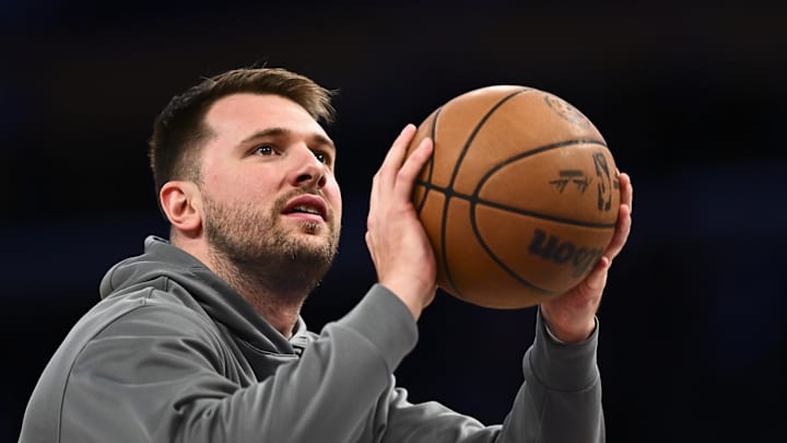 Apr 11, 2025; Los Angeles, California, USA; Los Angeles Lakers guard Luka Doncic (77) shoots before the game against the Houston Rockets at Crypto.com Arena. Mandatory Credit: Jonathan Hui-Imagn Images