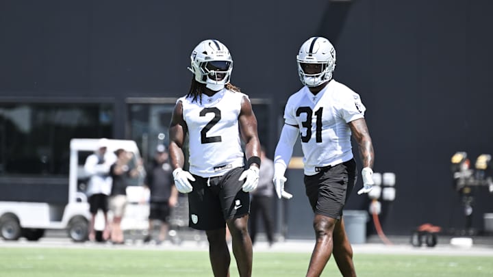 Jun 10, 2025; Henderson, NV, USA; Las Vegas Raiders running back Ashton Jeanty (2) and running back Raheem Mostert (31) between drills during Las Vegas Raiders Minicamp at Intermountain Health Performance Center. Mandatory Credit: Candice Ward-Imagn Images Jun 10, 2025; Henderson, NV, USA; Las Vegas Raiders running back Ashton Jeanty (2) and running back Raheem Mostert (31) between drills during Las Vegas Raiders Minicamp at Intermountain Health Performance Center. Mandatory Credit: Candice Ward-Imagn Images