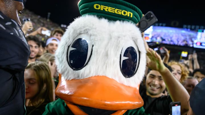 Oct 12, 2024; Eugene, Oregon, USA; Oregon Ducks mascot The Duck in the middle of the crowd storming the field after the game against the Ohio State Buckeyes at Autzen Stadium.