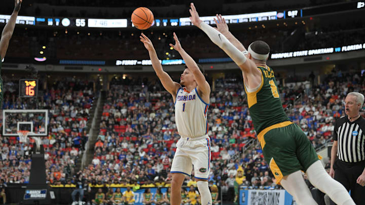Mar 21, 2025; Raleigh, NC, USA;  Florida Gators guard Walter Clayton Jr. (1) shoots the ball as Norfolk State Spartans forward Tyrel Bladen (8) defends during the second half at Lenovo Center. Mandatory Credit: Zachary Taft-Imagn Images