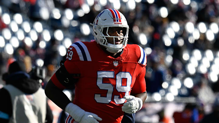 Dec 1, 2024; Foxborough, Massachusetts, USA; New England Patriots offensive tackle Vederian Lowe (59) warms up before a game against the Indianapolis Colts at Gillette Stadium. Mandatory Credit: Eric Canha-Imagn Images