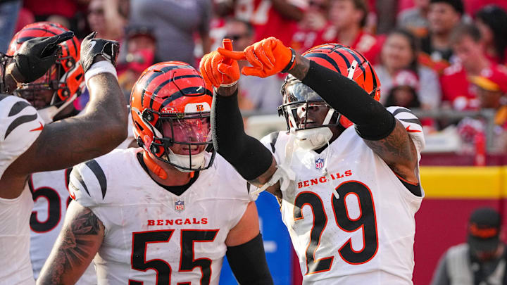 Sep 15, 2024; Kansas City, Missouri, USA; Cincinnati Bengals cornerback Cam Taylor-Britt (29) and linebacker Logan Wilson (55) celebrate against the Kansas City Chiefs after a play during the game at GEHA Field at Arrowhead Stadium.  