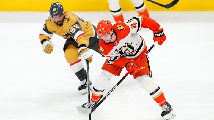 May 6, 2026; Las Vegas, Nevada, USA; Anaheim Ducks right wing Beckett Sennecke (45) steals the puck from Vegas Golden Knights right wing Keegan Kolesar (55) during the third period of game two of the second round of the 2026 Stanley Cup Playoffs at T-Mobile Arena. Mandatory Credit: Stephen R. Sylvanie-Imagn Images
