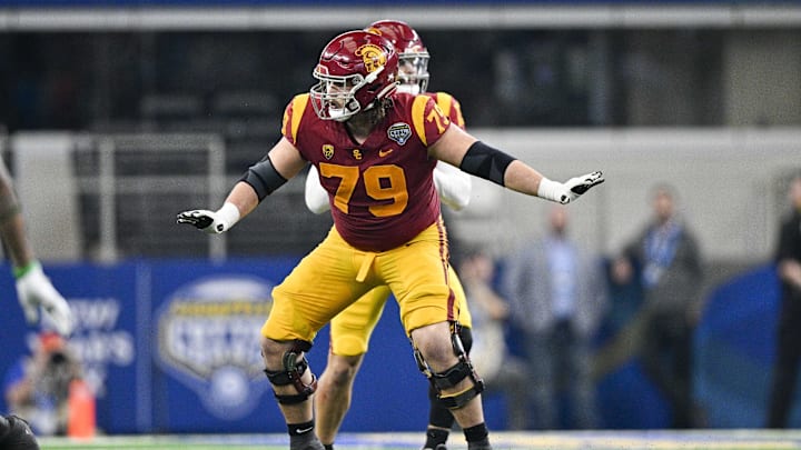 Jan 2, 2023; Arlington, Texas, USA; USC Trojans offensive lineman Jonah Monheim (79) in action during the game between the USC Trojans and the Tulane Green Wave in the 2023 Cotton Bowl at AT&T Stadium. Mandatory Credit: Jerome Miron-Imagn Images