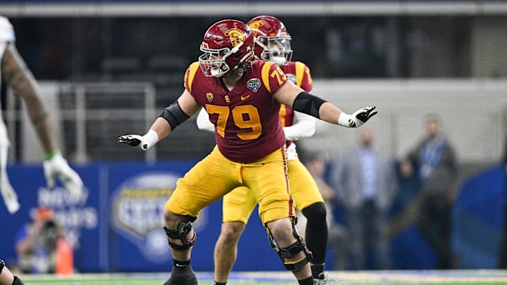Jan 2, 2023; Arlington, Texas, USA; USC Trojans offensive lineman Jonah Monheim (79) in action during the game between the USC Trojans and the Tulane Green Wave in the 2023 Cotton Bowl at AT&T Stadium. Mandatory Credit: Jerome Miron-Imagn Images