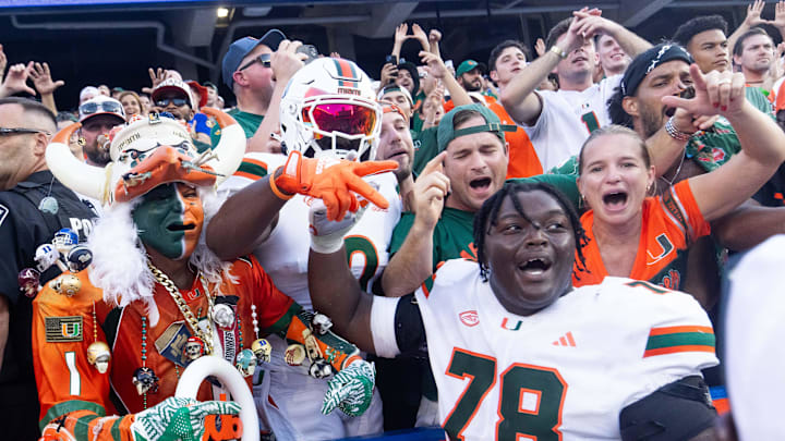 Miami Hurricanes offensive lineman Matthew McCoy (78) celebrates with fans after defeating the Gators during the season opener at Ben Hill Griffin Stadium in Gainesville, FL on Saturday, August 31, 2024 against the University of Miami Hurricanes. The Hurricanes defeated the Gators 41-17. [Doug Engle/Gainesville Sun]