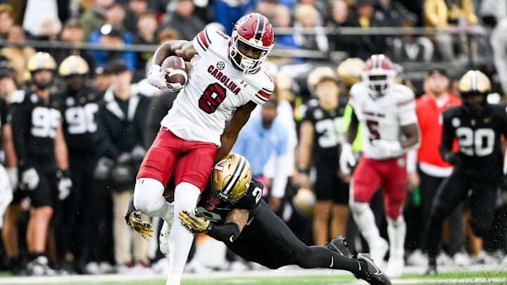 Nov 9, 2024; Nashville, Tennessee, USA;  South Carolina Gamecocks wide receiver Nyck Harbor (8) breaks the tackle of Vanderbilt Commodores linebacker Randon Fontenette (2) during the first half at FirstBank Stadium. Mandatory Credit: Steve Roberts-Imagn Images