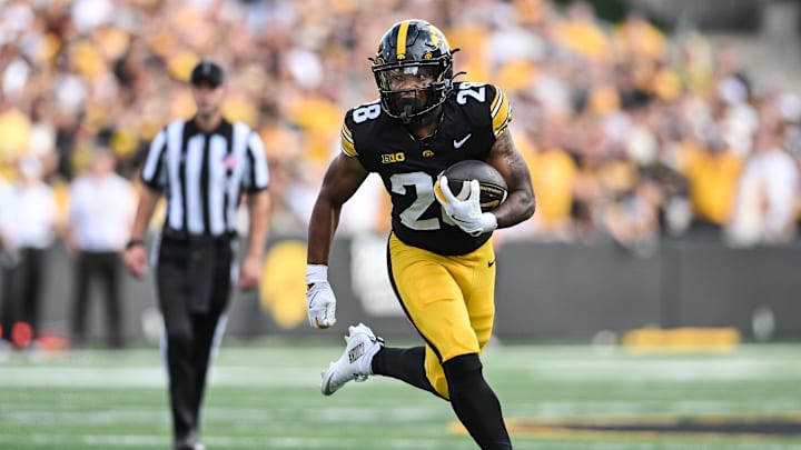 Aug 30, 2025; Iowa City, Iowa, USA; Iowa Hawkeyes running back Kamari Moulton (28) runs the ball against the Albany Great Danes during the first quarter at Kinnick Stadium. Mandatory Credit: Jeffrey Becker-Imagn Images