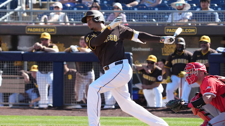 Feb 25, 2025; Peoria, Arizona, USA; San Diego Padres third base Manny Machado (13) bats against the Los Angeles Angels during the fourth inning at Peoria Sports Complex. Mandatory Credit: Rick Scuteri-Imagn Images
