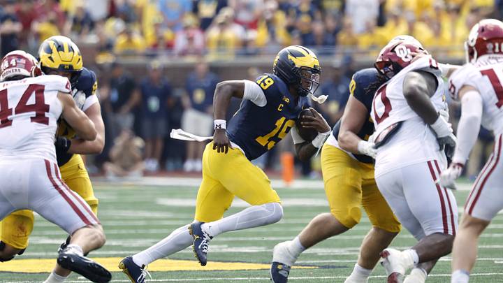 Sep 12, 2026; Ann Arbor, Michigan, USA; Michigan Wolverines quarterback Bryce Underwood (19) scrambles with the ball against the Oklahoma Sooners during the third quarter at Michigan Stadium. Mandatory Credit: Rick Osentoski-Imagn Images Sep 12, 2026; Ann Arbor, Michigan, USA; Michigan Wolverines quarterback Bryce Underwood (19) scrambles with the ball against the Oklahoma Sooners during the third quarter at Michigan Stadium. Mandatory Credit: Rick Osentoski-Imagn Images