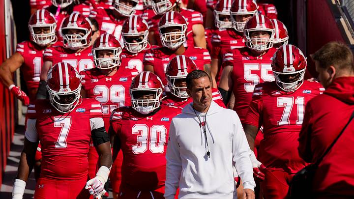 Wisconsin Badgers head coach Luke Fickell leads the team onto the field for warmups prior to the game against the Michigan State Spartans at Camp Randall Stadium. Wisconsin Badgers head coach Luke Fickell leads the team onto the field for warmups prior to the game against the Michigan State Spartans at Camp Randall Stadium.