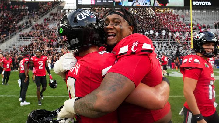 Sep 19, 2026; Cincinnati, Ohio, USA; Cincinnati Bearcats quarterback JC French IV and offensive lineman Judea Milon (71) celebrate on the field after defeating the Miami (OH) RedHawks at TQL Stadium. Mandatory Credit: Aaron Doster-Imagn Images Sep 19, 2026; Cincinnati, Ohio, USA; Cincinnati Bearcats quarterback JC French IV and offensive lineman Judea Milon (71) celebrate on the field after defeating the Miami (OH) RedHawks at TQL Stadium. Mandatory Credit: Aaron Doster-Imagn Images