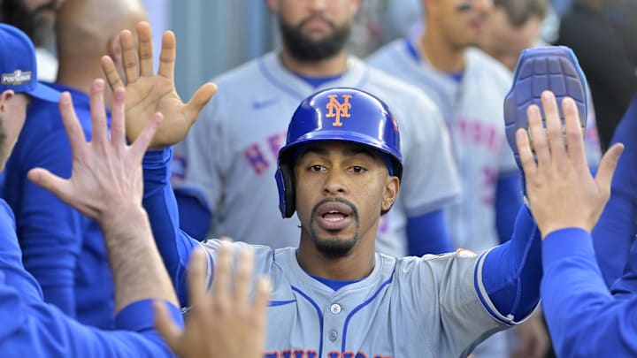 Oct 20, 2024; Los Angeles, California, USA; New York Mets shortstop Francisco Lindor (12) celebrates in the dugout after scoring in the first inning against the Los Angeles Dodgers during game six of the NLCS for the 2024 MLB playoffs at Dodger Stadium. Mandatory Credit: Jayne Kamin-Oncea-Imagn Images Oct 20, 2024; Los Angeles, California, USA; New York Mets shortstop Francisco Lindor (12) celebrates in the dugout after scoring in the first inning against the Los Angeles Dodgers during game six of the NLCS for the 2024 MLB playoffs at Dodger Stadium. Mandatory Credit: Jayne Kamin-Oncea-Imagn Images