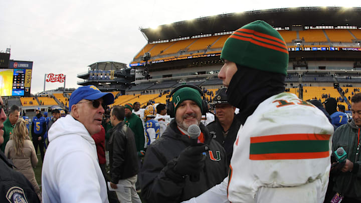 Nov 29, 2025; Pittsburgh, Pennsylvania, USA;  Pittsburgh Panthers head coach Pat Narduzzi (left) and Miami Hurricanes quarterback Carson Beck (11) shake hands after their game at Acrisure Stadium. Mandatory Credit: Charles LeClaire-Imagn Images