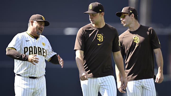 Jun 22, 2024; San Diego, California, USA; San Diego Padres pitching coach Ruben Niebla (left) talks to starting pitcher Michael King (center) and starting pitcher Dylan Cease (right) before the game against the Milwaukee Brewers at Petco Park. Mandatory Credit: Orlando Ramirez-Imagn Images Jun 22, 2024; San Diego, California, USA; San Diego Padres pitching coach Ruben Niebla (left) talks to starting pitcher Michael King (center) and starting pitcher Dylan Cease (right) before the game against the Milwaukee Brewers at Petco Park. Mandatory Credit: Orlando Ramirez-Imagn Images