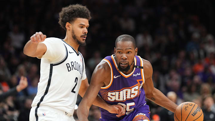 Phoenix Suns forward Kevin Durant drives against Brooklyn Nets forward Cameron Johnson. Phoenix Suns forward Kevin Durant drives against Brooklyn Nets forward Cameron Johnson.