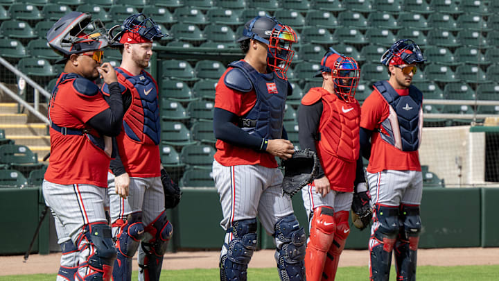 Feb 18, 2025; Lee County, FL, USA; Minnesota Twins catchers during the teamís spring training at the Lee Health Sports Complex . Credit: Chris Tilley-Imagn Images
