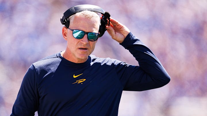 Aug 30, 2025; Lexington, Kentucky, USA; Toledo Rockets head coach Jason Candle looks on during the second quarter against the Kentucky Wildcats at Kroger Field. Mandatory Credit: Jordan Prather-Imagn Images Aug 30, 2025; Lexington, Kentucky, USA; Toledo Rockets head coach Jason Candle looks on during the second quarter against the Kentucky Wildcats at Kroger Field. Mandatory Credit: Jordan Prather-Imagn Images