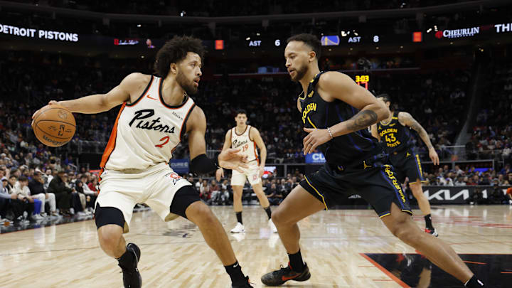 Jan 9, 2025; Detroit, Michigan, USA;  Detroit Pistons guard Cade Cunningham (2) rebound against Golden State Warriors forward Kyle Anderson (1) in the first half at Little Caesars Arena. Mandatory Credit: Rick Osentoski-Imagn Images