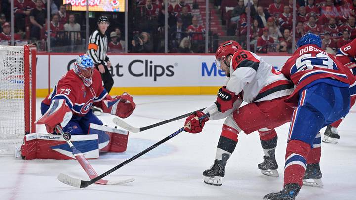 May 25, 2026; Montreal, Quebec, CAN; Carolina Hurricanes defenseman Sean Walker (26) shoots against Montreal Canadiens goaltender Jakub Dobes (75) and defenseman Noah Dobson (53) during the second period in game three of the Eastern Conference Final of the 2026 Stanley Cup Playoffs at Bell Centre. Mandatory Credit: Eric Bolte-Imagn Images May 25, 2026; Montreal, Quebec, CAN; Carolina Hurricanes defenseman Sean Walker (26) shoots against Montreal Canadiens goaltender Jakub Dobes (75) and defenseman Noah Dobson (53) during the second period in game three of the Eastern Conference Final of the 2026 Stanley Cup Playoffs at Bell Centre. Mandatory Credit: Eric Bolte-Imagn Images