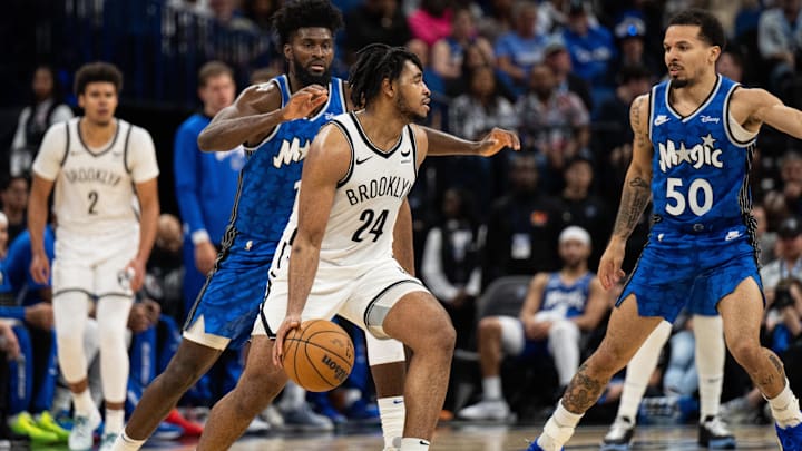 Mar 13, 2024; Orlando, Florida, USA; Brooklyn Nets guard Cam Thomas (24) dribbles the ball against Orlando Magic guard Cole Anthony (50) in the fourth quarter at Kia Center. Mandatory Credit: Jeremy Reper-Imagn Images