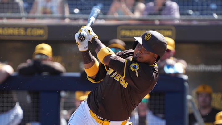 Feb 25, 2025; Peoria, Arizona, USA; San Diego Padres first base Luis Arraez (4) bats against the Los Angeles Angels during the first inning at Peoria Sports Complex. Mandatory Credit: Rick Scuteri-Imagn Images