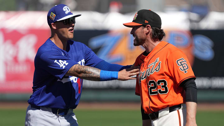 Feb 27, 2026; Scottsdale, Arizona, USA; Los Angeles Dodgers third baseman Nick Senzel (15) talks to San Francisco Giants manager Tony Vitello (23) before a game at Scottsdale Stadium. Mandatory Credit: Rick Scuteri-Imagn Images