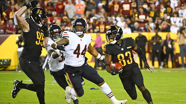 Oct 5, 2023; Landover, Maryland, USA; Washington Commanders wide receiver Jamison Crowder (83) carries the ball against the Chicago Bears during the second half at FedExField. Mandatory Credit: Brad Mills-Imagn Images
