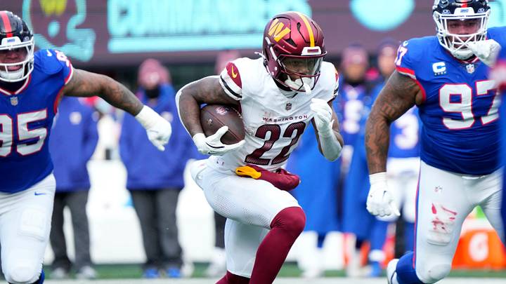 Washington Commanders running back Jacory Croskey-Merritt (22) runs against the Giants' defense on Sunday, December 14, 2025. Washington Commanders running back Jacory Croskey-Merritt (22) runs against the Giants' defense on Sunday, December 14, 2025.