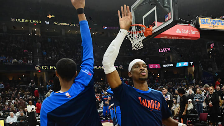 Jan 8, 2025; Cleveland, Ohio, USA; Oklahoma City Thunder guard Shai Gilgeous-Alexander, right, is introduced before the game between the Cleveland Cavaliers and the Thunder at Rocket Mortgage FieldHouse. Mandatory Credit: Ken Blaze-Imagn Images Jan 8, 2025; Cleveland, Ohio, USA; Oklahoma City Thunder guard Shai Gilgeous-Alexander, right, is introduced before the game between the Cleveland Cavaliers and the Thunder at Rocket Mortgage FieldHouse. Mandatory Credit: Ken Blaze-Imagn Images