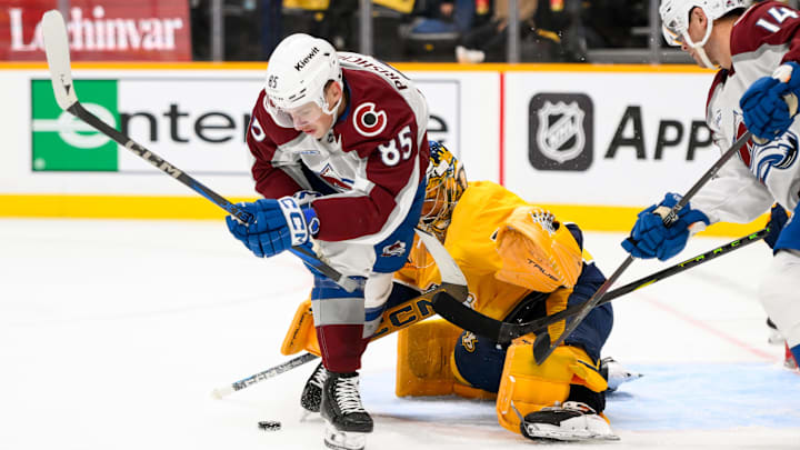 Nov 2, 2024; Nashville, Tennessee, USA; Nashville Predators goaltender Juuse Saros (74) blocks the shot of Colorado Avalanche center Nikita Prishchepov (85) during the second period at Bridgestone Arena. Mandatory Credit: Steve Roberts-Imagn Images Nov 2, 2024; Nashville, Tennessee, USA; Nashville Predators goaltender Juuse Saros (74) blocks the shot of Colorado Avalanche center Nikita Prishchepov (85) during the second period at Bridgestone Arena. Mandatory Credit: Steve Roberts-Imagn Images