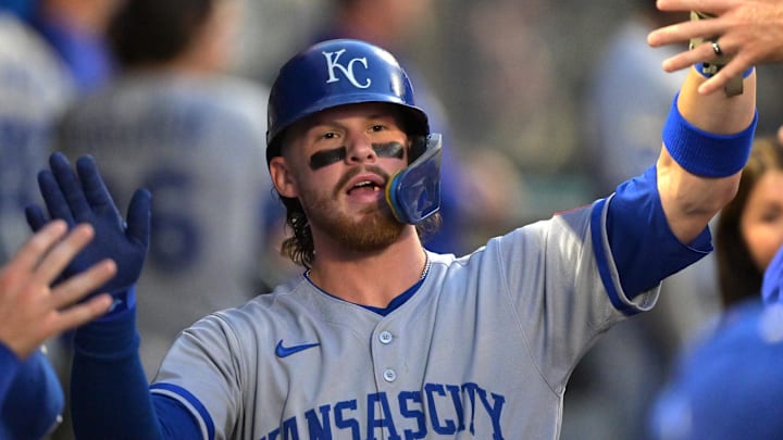Sep 23, 2025; Anaheim, California, USA;  Kansas City Royals shortstop Bobby Witt Jr. (7) is greeted in the dugout after scoring during the first inning against the Los Angeles Angels at Angel Stadium. Mandatory Credit: Jayne Kamin-Oncea-Imagn Images