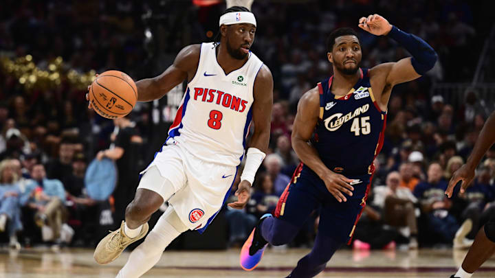 May 11, 2026; Cleveland, Ohio, USA; Detroit Pistons guard Caris LeVert (8) brings the ball up court against Cleveland Cavaliers guard Donovan Mitchell (45) during the first half of game four in the second round of the 2026 NBA Playoffs at Rocket Arena. Mandatory Credit: Ken Blaze-Imagn Images