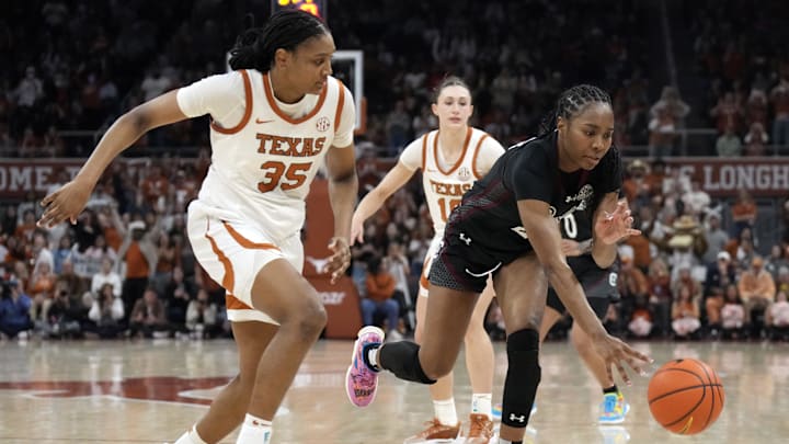 Feb 9, 2025; Austin, Texas, USA; South Carolina Gamecocks guard Bree Hall (23) battles for the ball with Texas Longhorns forward Madison Booker (35) during the second half at Moody Center. Mandatory Credit: Scott Wachter-Imagn Images