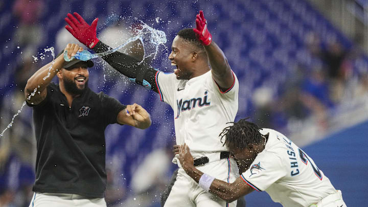May 2, 2024; Miami, Florida, USA; Miami Marlins right fielder Jesús Sánchez, center, celebrates the game-winning hit in the tenth inning against the Colorado Rockies at loanDepot Park with Sandy Alcantara, left, and Miami Marlins center fielder Jazz Chisholm Jr. (2). Mandatory Credit: Jim Rassol-Imagn Images May 2, 2024; Miami, Florida, USA; Miami Marlins right fielder Jesús Sánchez, center, celebrates the game-winning hit in the tenth inning against the Colorado Rockies at loanDepot Park with Sandy Alcantara, left, and Miami Marlins center fielder Jazz Chisholm Jr. (2). Mandatory Credit: Jim Rassol-Imagn Images