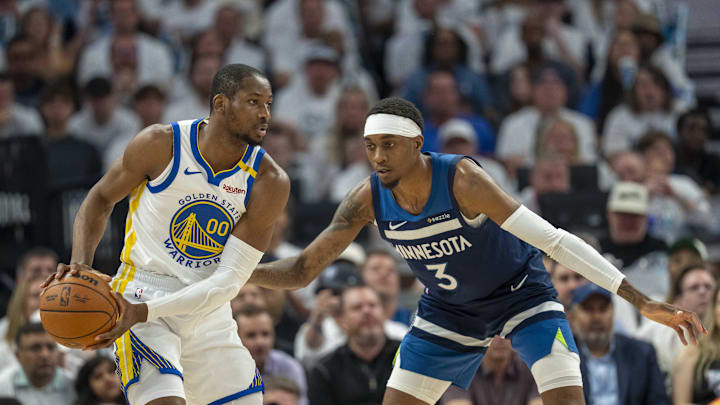 May 14, 2025; Minneapolis, Minnesota, USA; Golden State Warriors forward Jonathan Kuminga (00) looks to pass the ball as Minnesota Timberwolves forward Jaden McDaniels (3) plays defense in the first half during game five of the second round for the 2025 NBA Playoffs at Target Center. Mandatory Credit: Jesse Johnson-Imagn Images May 14, 2025; Minneapolis, Minnesota, USA; Golden State Warriors forward Jonathan Kuminga (00) looks to pass the ball as Minnesota Timberwolves forward Jaden McDaniels (3) plays defense in the first half during game five of the second round for the 2025 NBA Playoffs at Target Center. Mandatory Credit: Jesse Johnson-Imagn Images