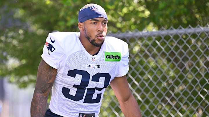 Jul 28, 2025; Foxborough, MA, USA; New England Patriots running back TreVeyon Henderson (32) heads to the practice fields for training camp at Gillette Stadium. Mandatory Credit: Eric Canha-Imagn Images