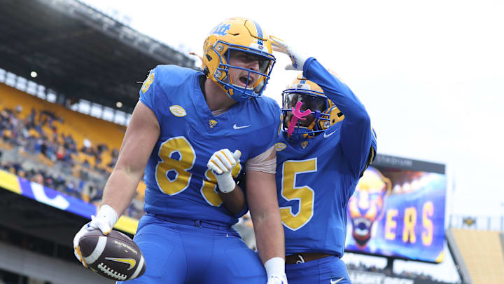 Nov 29, 2025; Pittsburgh, Pennsylvania, USA;  Pittsburgh Panthers tight end Justin Holmes (88) reacts with wide receiver Raphael Williams Jr. (5) after his touchdown against the Miami Hurricanes during the second quarter at Acrisure Stadium. Mandatory Credit: Charles LeClaire-Imagn Images