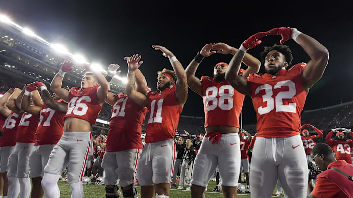 Sept. 7, 2024; Columbus, Ohio, USA; Ohio State Buckeyes running back TreVeyon Henderson (32) sings “Carmen Ohio” with teammates following a 56-0 victory over Western Michigan at Ohio Stadium. Mandatory Credit: Barbara J. Perenic/USA TODAY Network via Imagn Images