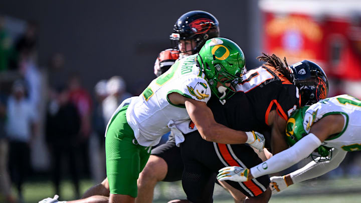 Oregon Ducks defense takes down Oregon State Beavers running back Anthony Hankerson (0) in the second half of the annual rivalry game on Saturday, Sept. 14, 2024 at Reser Stadium in Corvallis, Ore.
