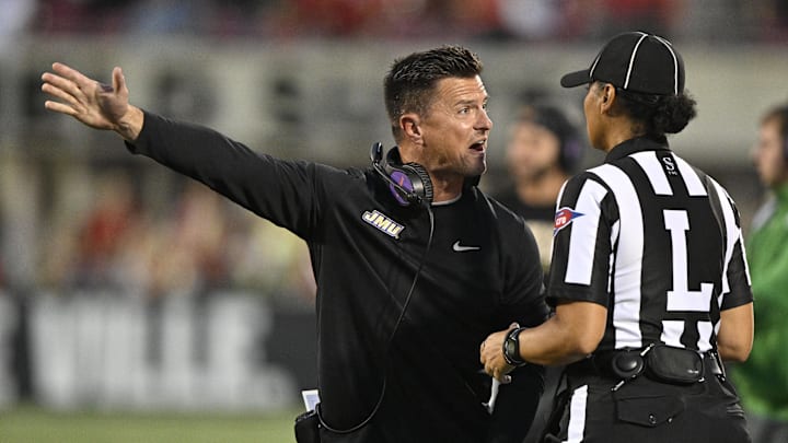 Sep 5, 2025; Louisville, Kentucky, USA; James Madison Dukes head coach Bob Chesney argues a call with an official during the first half against the Louisville Cardinals at L&N Federal Credit Union Stadium. Mandatory Credit: Jamie Rhodes-Imagn Images Sep 5, 2025; Louisville, Kentucky, USA; James Madison Dukes head coach Bob Chesney argues a call with an official during the first half against the Louisville Cardinals at L&N Federal Credit Union Stadium. Mandatory Credit: Jamie Rhodes-Imagn Images