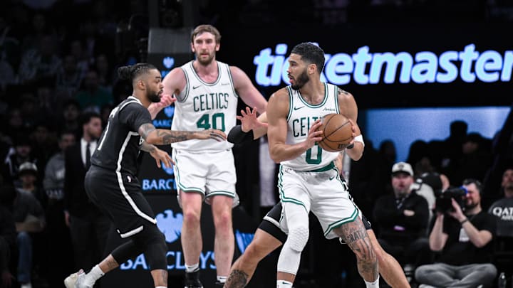 Mar 15, 2025; Brooklyn, New York, USA; Boston Celtics forward Jayson Tatum (0) looks to pass the ball as Brooklyn Nets guard Tyrese Martin (13) defends during the first half at Barclays Center. Mandatory Credit: John Jones-Imagn Images Mar 15, 2025; Brooklyn, New York, USA; Boston Celtics forward Jayson Tatum (0) looks to pass the ball as Brooklyn Nets guard Tyrese Martin (13) defends during the first half at Barclays Center. Mandatory Credit: John Jones-Imagn Images