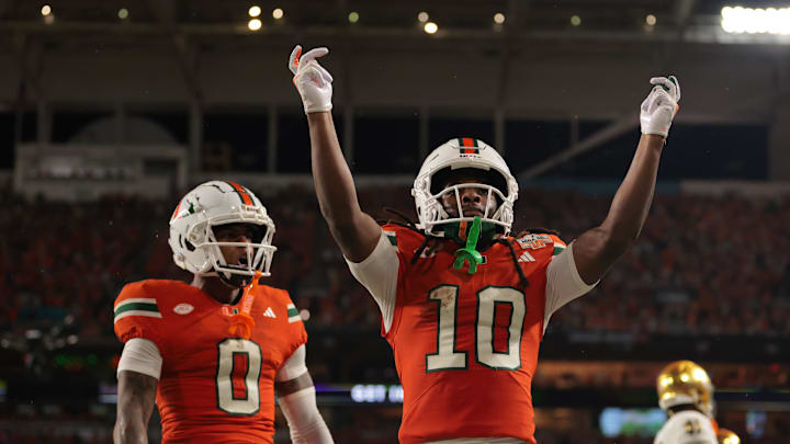 Aug 31, 2025; Miami Gardens, Florida, USA; Miami Hurricanes wide receiver Malachi Toney (10) reacts after scoring a touchdown against the Notre Dame Fighting Irish during the first quarter at Hard Rock Stadium. Mandatory Credit: Sam Navarro-Imagn Images