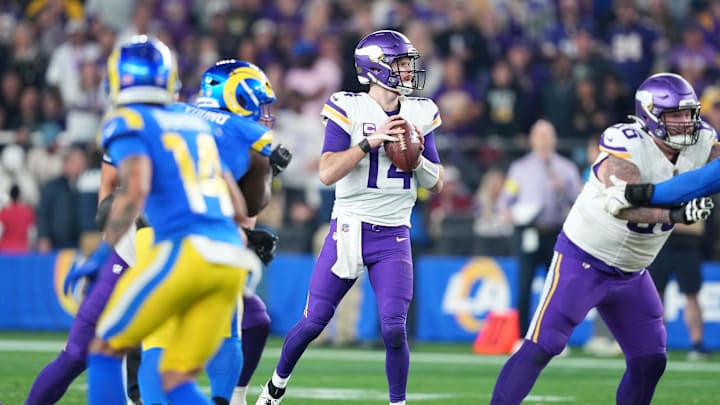 Jan 13, 2025; Glendale, AZ, USA; Minnesota Vikings quarterback Sam Darnold (14) drops back to pass against the Los Angeles Rams during the second half in an NFC wild card game at State Farm Stadium. Mandatory Credit: Joe Camporeale-Imagn Images Jan 13, 2025; Glendale, AZ, USA; Minnesota Vikings quarterback Sam Darnold (14) drops back to pass against the Los Angeles Rams during the second half in an NFC wild card game at State Farm Stadium. Mandatory Credit: Joe Camporeale-Imagn Images