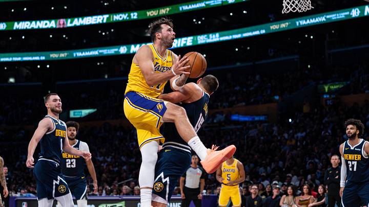 Oct 16, 2026; Los Angeles, California, USA; Los Angeles Lakers guard Luka Doncic (77) is fouled and scores against Denver Nuggets center Nikola Jokic (15) in the second quarter at Crypto.com Arena. Mandatory Credit: Jon Endow-Imagn Images Oct 16, 2026; Los Angeles, California, USA; Los Angeles Lakers guard Luka Doncic (77) is fouled and scores against Denver Nuggets center Nikola Jokic (15) in the second quarter at Crypto.com Arena. Mandatory Credit: Jon Endow-Imagn Images