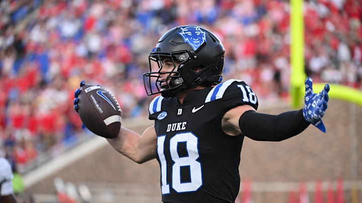 Sep 20, 2025; Durham, North Carolina, USA; Duke Blue Devils wide receiver Cooper Barkate (18) celebrates a touchdown during the third quarter against the NC State Wolfpack at Wallace Wade Stadium. Mandatory Credit: Zachary Taft-Imagn Images Sep 20, 2025; Durham, North Carolina, USA; Duke Blue Devils wide receiver Cooper Barkate (18) celebrates a touchdown during the third quarter against the NC State Wolfpack at Wallace Wade Stadium. Mandatory Credit: Zachary Taft-Imagn Images
