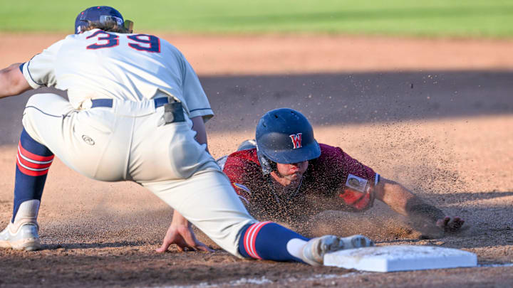 HARWICH 07/02/24 Brendan Summerhill of Wareham is forced by Michael Anderson of Harwich as he dives back to first. Cape League baseball. HARWICH 07/02/24 Brendan Summerhill of Wareham is forced by Michael Anderson of Harwich as he dives back to first. Cape League baseball.
