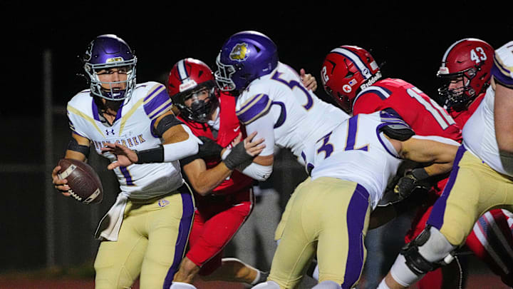 Queen Creek quarterback Tait Reynolds (1) scrambles to avoid pressure against ALA Queen Creek during a game at ALA Queen Creek High School in Queen Creek on Nov. 8, 2024. Queen Creek quarterback Tait Reynolds (1) scrambles to avoid pressure against ALA Queen Creek during a game at ALA Queen Creek High School in Queen Creek on Nov. 8, 2024.