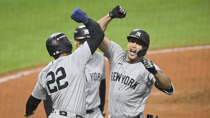 Oct 18, 2024; Cleveland, Ohio, USA; New York Yankees designated hitter Giancarlo Stanton (27) celebrates a three run home run with outfielder Juan Soto (22) in the sixth inning against the Cleveland Guardians during game four of the ALCS for the 2024 MLB playoffs at Progressive Field. Mandatory Credit: David Richard-Imagn Images